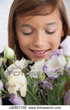Pretty girl with flowers View Large Photo Image Stock Photograph - Pretty girl with flowers. Fotosearch
