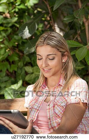 Stock Image - Pretty woman relaxed. Fotosearch
