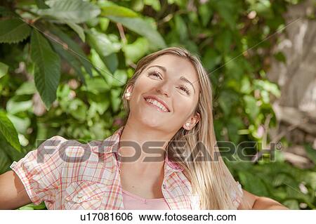 Pretty woman smiling View Large Photo Image Stock Photograph - Pretty woman smiling. Fotosearch
