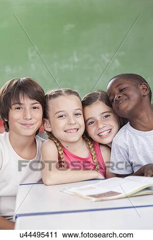 Pupils looking at camera and smiling View Large Photo Image Stock Image - Pupils looking at camera and smiling. Fotosearch