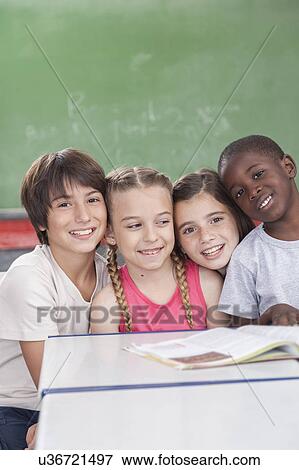 Pupils looking at camera and smiling View Large Photo Image Stock Photo - Pupils looking at camera and smiling. Fotosearch