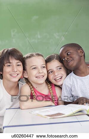 Stock Photo - Pupils looking at camera and smiling. Fotosearch