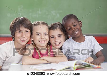Stock Image - Pupils looking at camera. Fotosearch