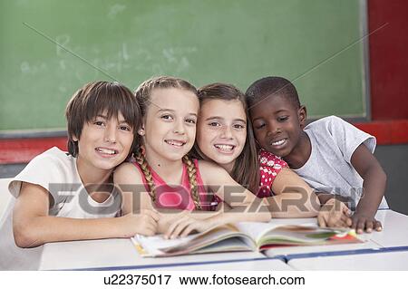 Stock Photo - Pupils looking at the teacher. Fotosearch