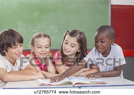 Picture - Pupils reading togethers. Fotosearch