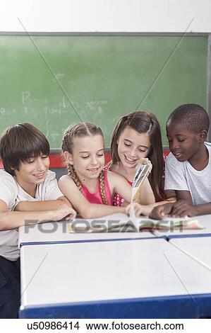 Pupils reading togethers View Large Photo Image Picture - Pupils reading togethers. Fotosearch