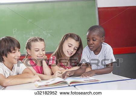 Pupils reading togethers View Large Photo Image Stock Image - Pupils reading togethers. Fotosearch
