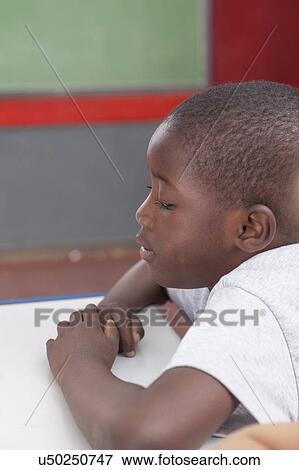 Quiet african boy View Large Photo Image Stock Photo - Quiet african boy. Fotosearch