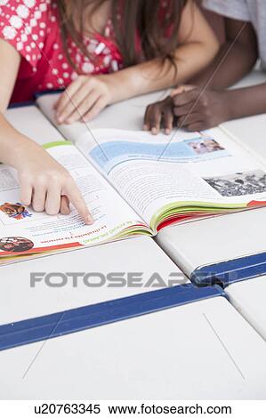 Stock Photography - Reading a book. Fotosearch