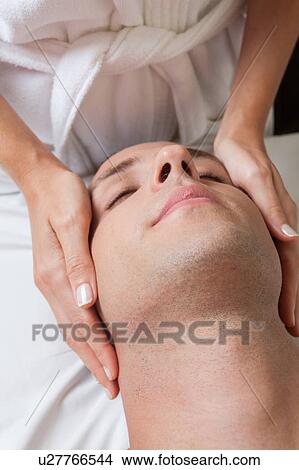 Picture - Relaxed man gets a massage. Fotosearch