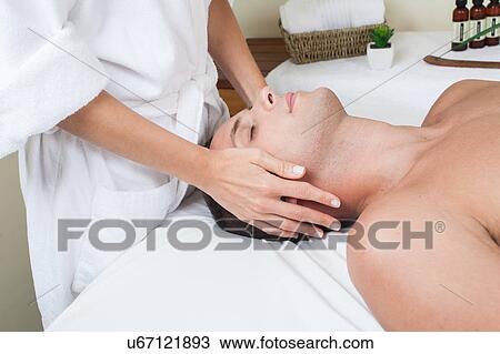 Relaxed man gets a massage View Large Photo Image Stock Image - Relaxed man gets a massage. Fotosearch