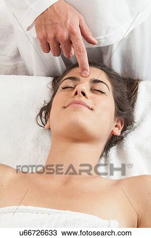 Relaxed woman gets a massage on her head View Large Photo Image Stock Image - Relaxed woman gets a massage on her head. Fotosearch