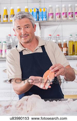 Seller of seafood View Large Photo Image Stock Image - Seller of seafood. Fotosearch
