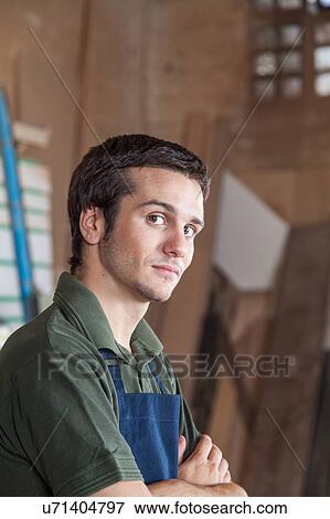 Serious carpenter in his workshop View Large Photo Image Stock Photo - Serious carpenter in his workshop. Fotosearch