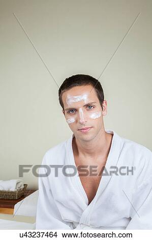 Serious guy with cream on her face View Large Photo Image Picture - Serious guy with cream on her face. Fotosearch