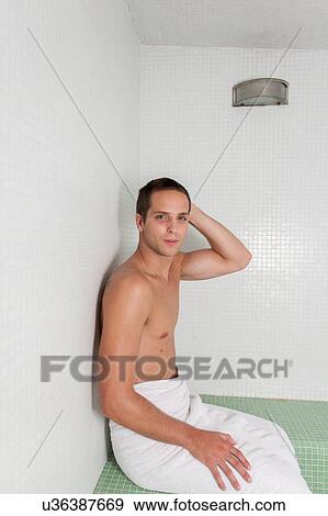 Stock Photo - Serious man in the sauna. Fotosearch
