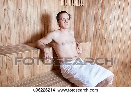 Picture - Serious man inside the Sauna. Fotosearch