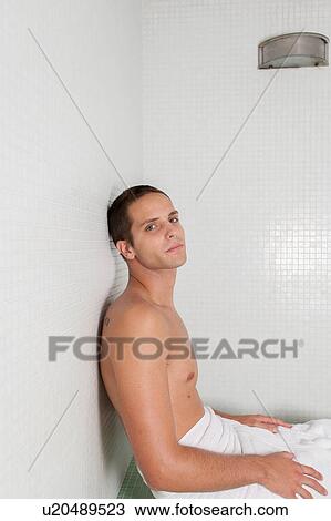 Stock Image - Serious man inside the sauna. Fotosearch
