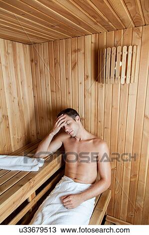 Serious man resting in the sauna View Large Photo Image Stock Image - Serious man resting in the sauna. Fotosearch