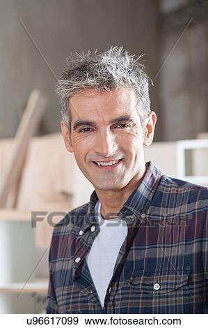Stock Photo - Smiling carpenter. Fotosearch