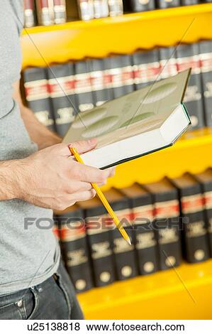 Student reading a book View Large Photo Image Stock Photo - Student reading a book. Fotosearch