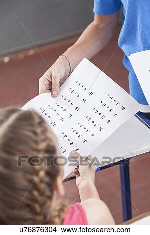 Picture - Teacher giving the exam. Fotosearch