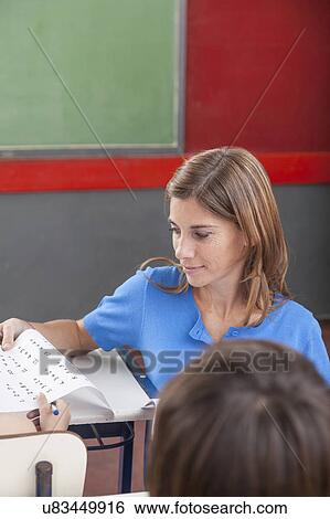 Teacher giving the exam View Large Photo Image Stock Photograph - Teacher giving the exam. Fotosearch