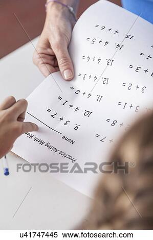 Stock Photography - Teacher giving the exam. Fotosearch