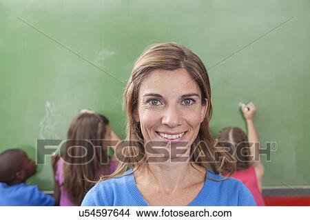Picture - Teacher looking at camera. Fotosearch
