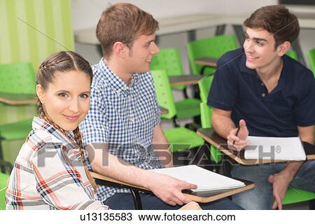 Stock Image - Teenagers in school. Fotosearch