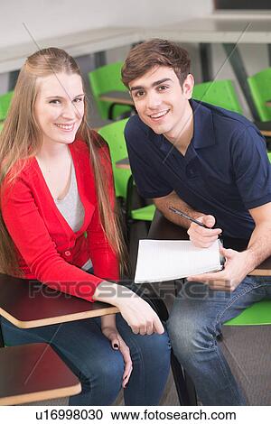 Stock Image - Teenagers in school. Fotosearch