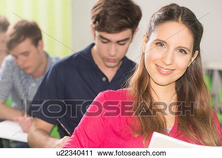 Stock Image - Teenagers in school. Fotosearch
