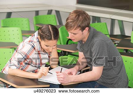 Stock Image - Teenagers in school. Fotosearch