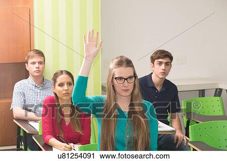 Stock Image - Teenagers in school. Fotosearch