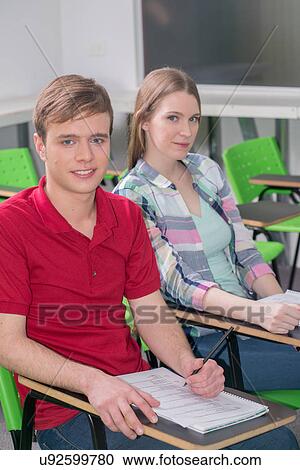 Stock Image - Teenagers in school. Fotosearch