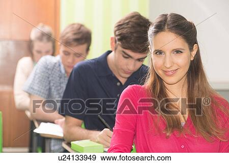 Stock Photo - Teenagers in school. Fotosearch