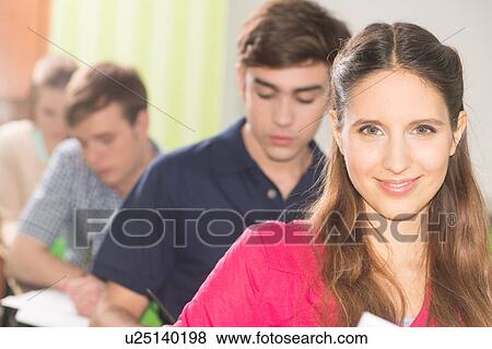 Stock Photo - Teenagers in school. Fotosearch