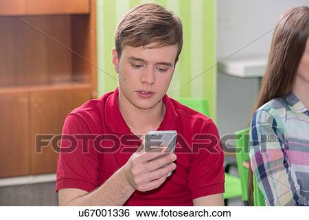 Stock Photograph - Teenagers in school. Fotosearch