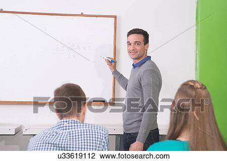 Stock Image - Teenagers in the college. Fotosearch