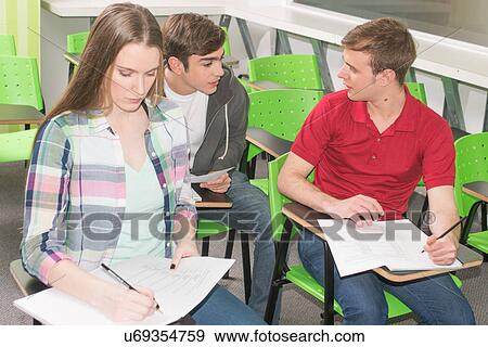 Stock Photo - Teenagers studying. Fotosearch