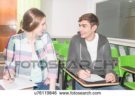 Stock Photograph - Teenagers studying. Fotosearch