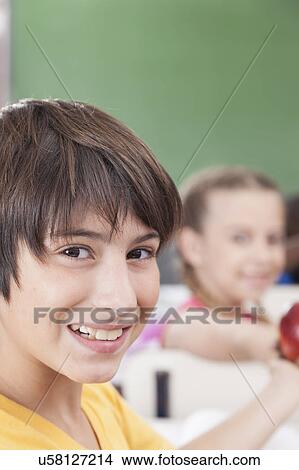 Picture - The boy looking at camera. Fotosearch