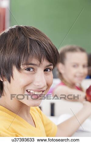 Stock Image - The boy looking at camera. Fotosearch