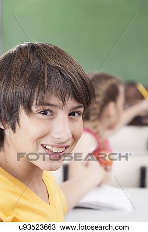 Stock Image - The boy looking at camera. Fotosearch