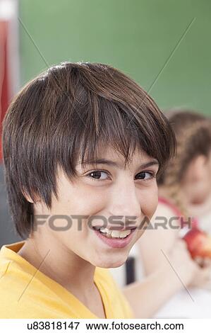 Stock Photo - The boy looking at camera. Fotosearch