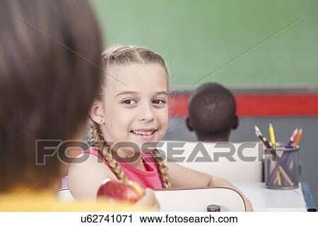 The girl giving an apple View Large Photo Image Stock Image - The girl giving an apple. Fotosearch