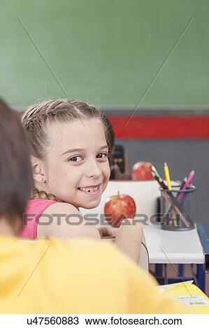 Stock Image - The girl looking at back. Fotosearch