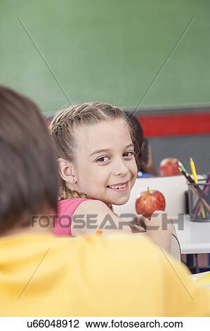 Stock Image - The girl looking at back. Fotosearch
