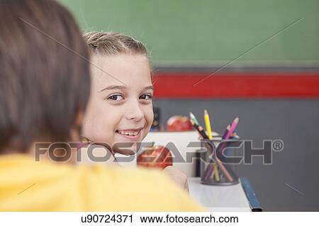 Stock Image - The girl looking at back. Fotosearch