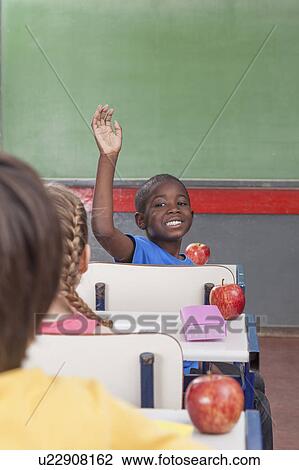 Stock Image - The pupil hand up. Fotosearch